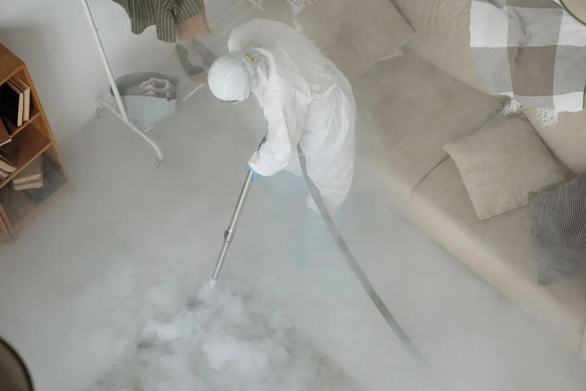 Biohazard cleanup technician in protective equipment, Amite City, LA
